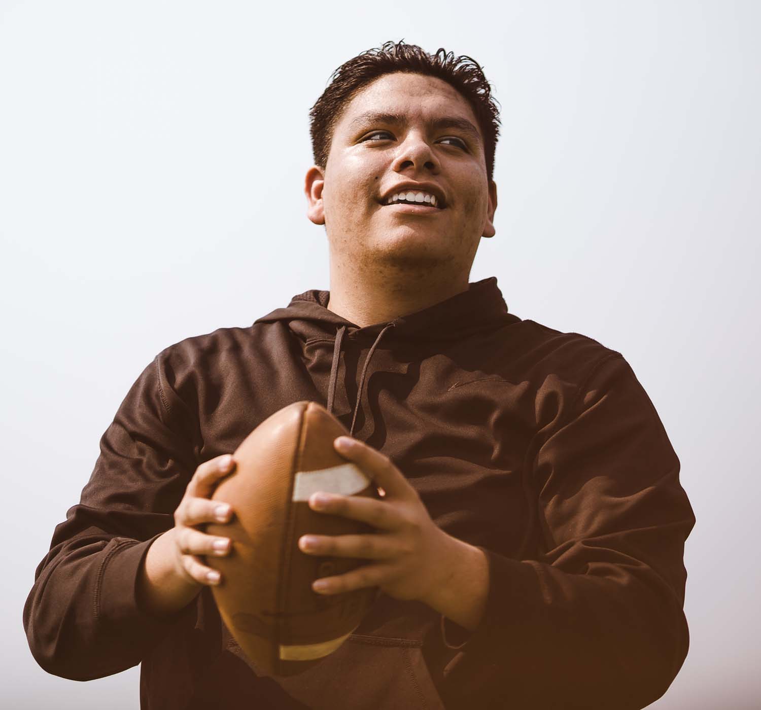 man holding football man holding football