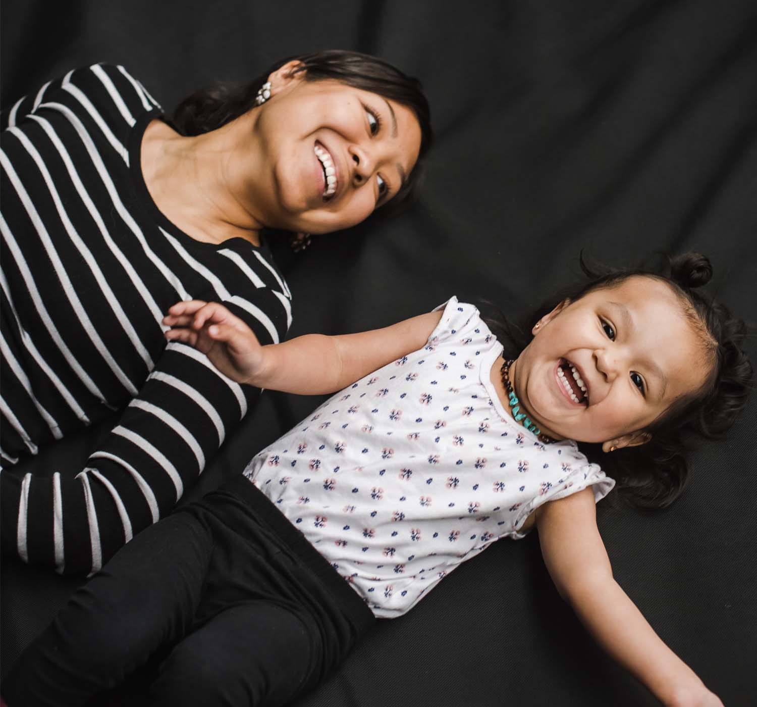 mother with daughter lying in bed mother with daughter lying in bed